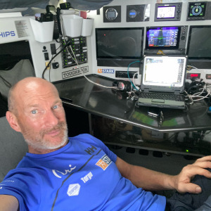 Ari Huusela resting in front of his cardtable