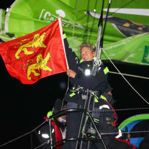 Miranda Merron shows the colours of Normandy after crossing the line