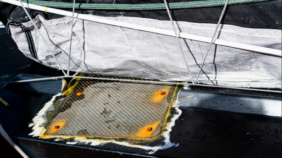 Repair of the cracked deck with a carbon plate on Maxime Sorel's IMOCA